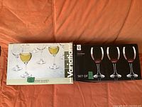 Two boxed sets of wine glasses, 11 pieces each