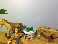 Full lot showing Woody, Bullseye, bucket of soldiers, boxed Slinky Dog