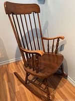 full view of wooden rocking chair showing overall design and finish