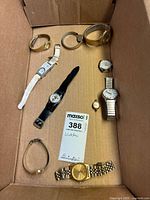 Overview image showing all ten watches in a box, various band types and sizes visible.