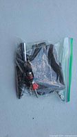 sealed bag containing mixed drill bits and cutting accessories