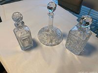 All three crystal decanters with stoppers