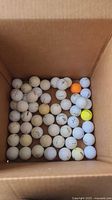 Box containing multiple golf balls