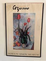 Full view of vintage framed poster showing tulips in a vase and fruit still life with text 'Cezanne' and 'Norton Simon Museum'.