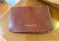 Leather zippered case with gold embossed name of Captain W. P. Cogswell U.S. Navy