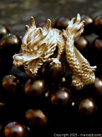 Angled view showing dragon head and body around band