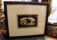 Front view of framed antler etching