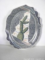 full view of cactus-motif speckled porcelain plate