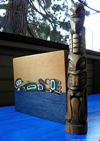 Totem and plaque together showing size relationship