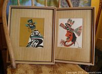 Two framed serigraphs side by side