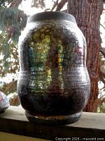 Full view of vase showing shape and metallic Raku glaze