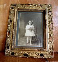 Framed portrait standing upright showing full frame and image