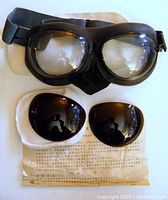 Goggles, spare lenses, instruction sheet