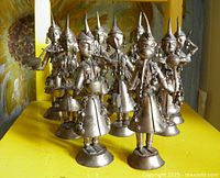 All nine silver-tone Hindu musician figurines grouped