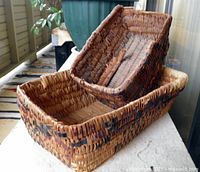 Both baskets nested, showing size comparison and weave pattern