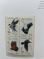 Interior page with 45¢ migratory birds block of four stamps