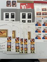 Overview of assorted stamp booklets and souvenir sheets on table
