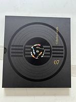 Black slipcase front view titled 07 Collection Canada