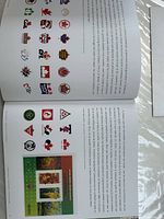 Open album showing stamp mounts and sports logos