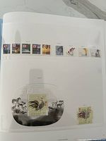 Album page showing several 2005 Canadian commemorative stamps mounted