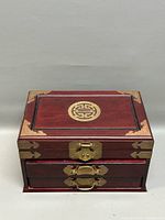 Closed box front view showing brass hardware