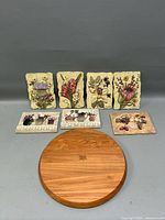 Full lot showing cutting board, six plaques, small resin accents