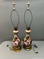 Front view of both lamps showing matching design, harps, finials