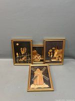 Group shot of four framed marquetry pictures