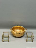 Front view of Pickard bowl flanked by two brass-glass boxes