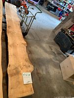 Full view of the live edge slab on garage floor