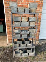 Full view of shelving unit loaded with galvanized boxes