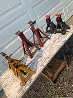 All six jack stands on table showing colors and styles