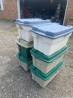 Stack of six Rubbermaid Rough Tote bins showing overall quantity and condition