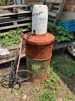 Full view of BP barrel with Graco greaser and hoses