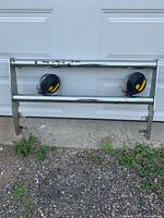 front view of chrome bumper light bar with two lamps attached