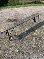 Full view of weathered hardwood folding bench