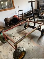 full view of steel utility cart frame and wheels