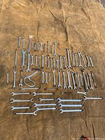 Overhead view of entire 67-piece wrench assortment spread on tarp