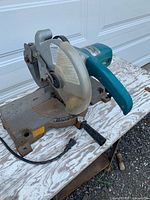 Front/side view of Makita LS1020 miter saw on table