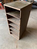 Front angle showing open cubby shelves and dimensions perspective