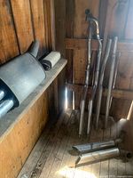 overall view of headers, mufflers and pipes in shed