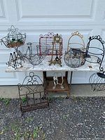 Group view of assorted wire décor pieces on table