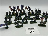 Group of painted Union miniatures arranged on white surface