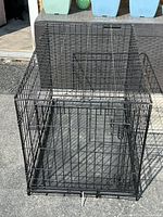 Overall view of black wire dog crate