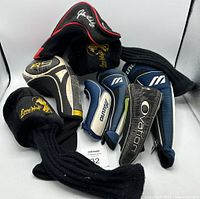 Group view of all seven assorted golf club headcovers