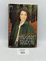 Book standing upright showing full front dust jacket with title and author