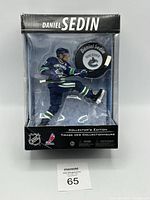 Front view of sealed Daniel Sedin figure in original box