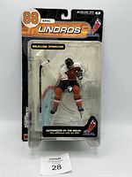 Front view sealed package showing Eric Lindros figure and branding
