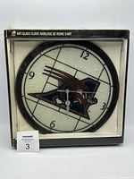 Front of boxed Montreal Alouettes art-glass clock