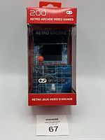 Front view of boxed mini arcade console